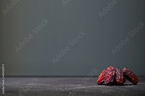 Persons standing on a black background. Ramadan fasting food for Muslims.