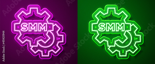 Glowing neon line SMM icon isolated on purple and green background. Social media marketing, analysis, advertising strategy development. Vector.