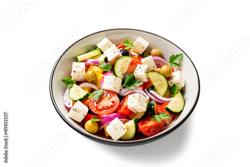 Classic Greek salad with fresh vegetables, feta cheese and olives. Healthy food. isolated on white background