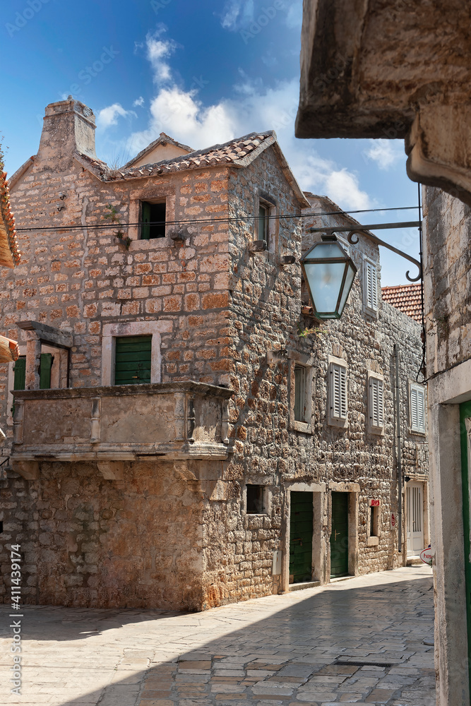 Hvar island, Croatia, popular touristic destination. Colorful traditional European houses on a sunny day Hvar island, Croatia, popular touristic destination. Colorful traditional European houses on a sunny day