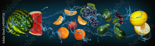 Fototapeta Naklejka Na Ścianę i Meble -  Panorama with fruits in water - arbaz, tangerine, grapes, avocado, cherry, melon - pep and body every day