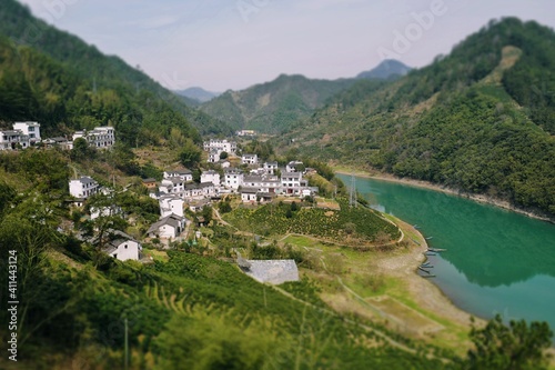 Aerial shots of villages among rivers and mountains.