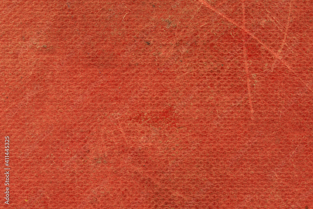 Fototapeta premium The texture of the old book cover is orange. Grunge background, worn vintage surface