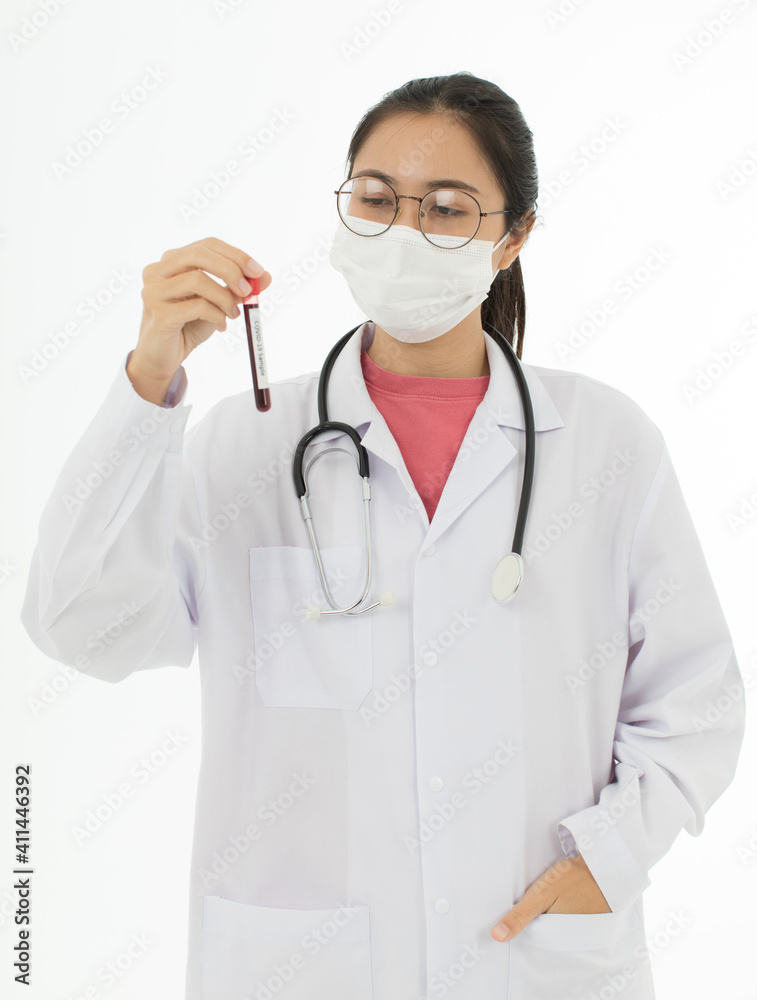 Portrait of Asian female doctor in white gown coat wearing eyes glasses in white background holding test tube of coronavirus covid 19 vaccine sample Portrait of Asian female doctor in white gown coat wearing eyes glasses in white background holding test tube of coronavirus covid 19 vaccine sample