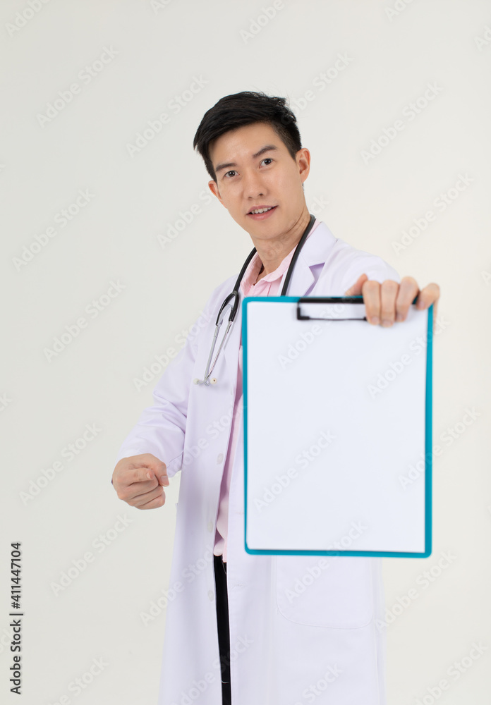 Asian male doctor holding and pointing to blank medical char Asian male doctor holding and pointing to blank medical char