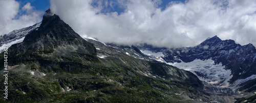 wonderful rocky mountains with snow and a huge glacier panorama