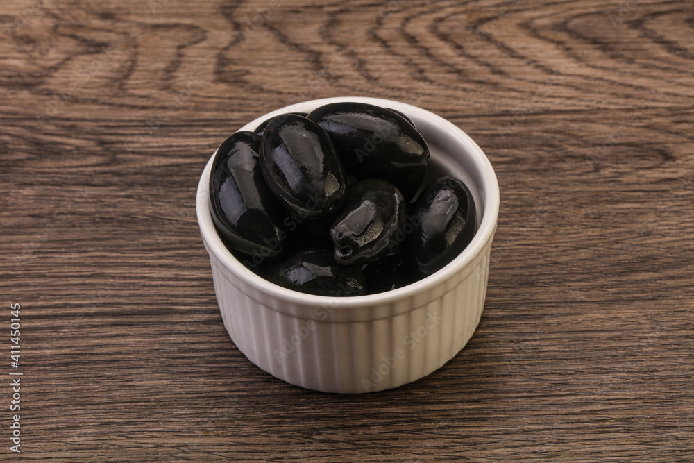 Pickled black olives in the bowl Pickled black olives in the bowl