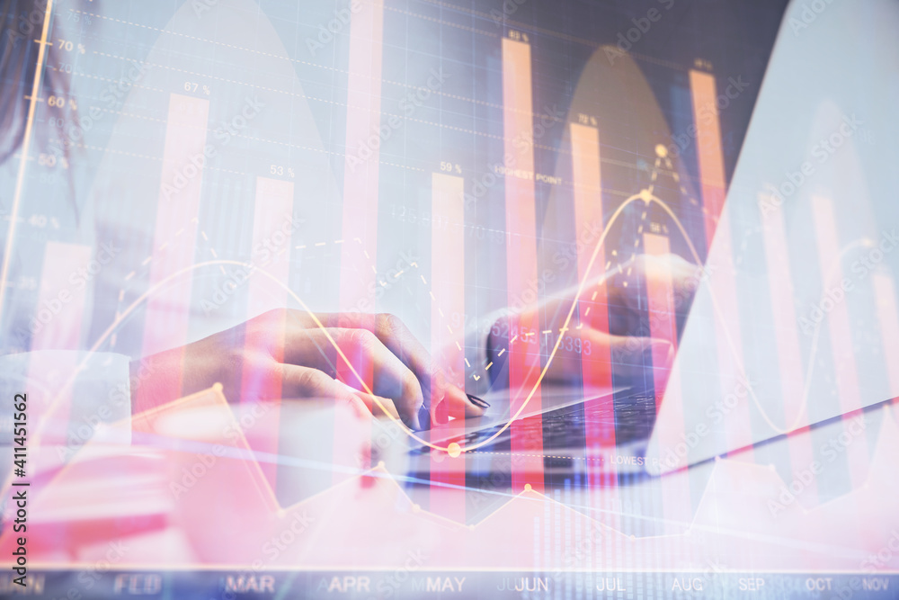 Double exposure of woman hands working on computer and forex graph hologram drawing. Financial analysis concept. Double exposure of woman hands working on computer and forex graph hologram drawing. Financial analysis concept.