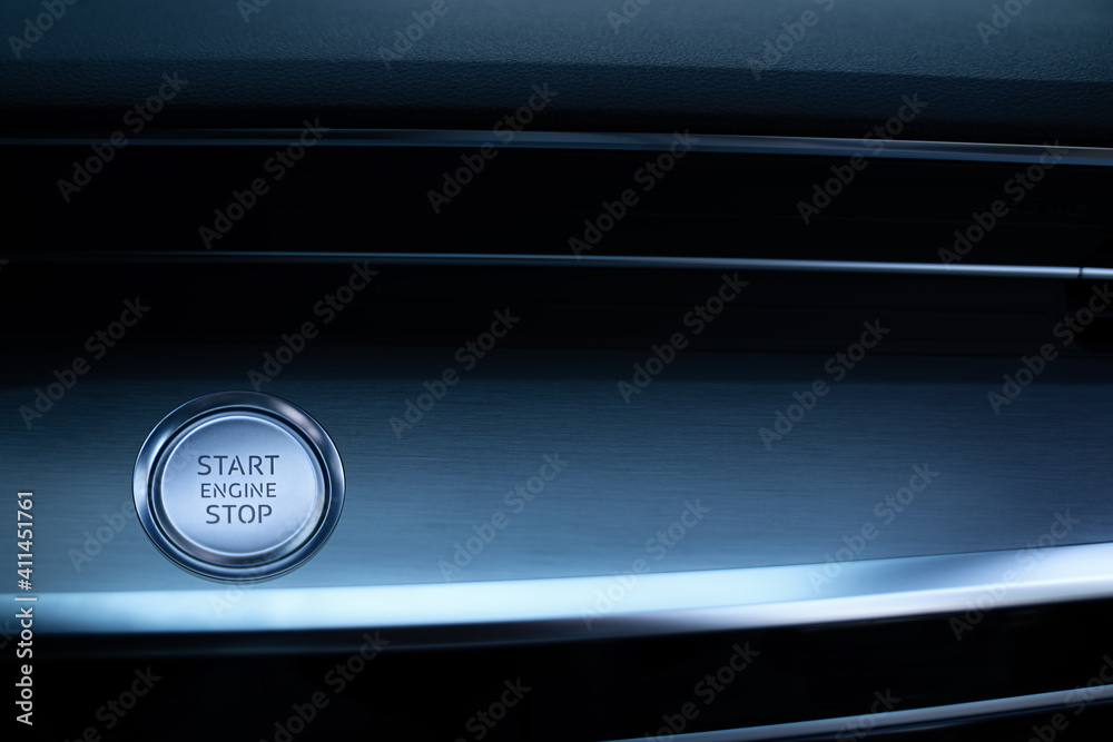 Engine start stop button. Car driver starting the engine. Engine start stop button. Car driver starting the engine.