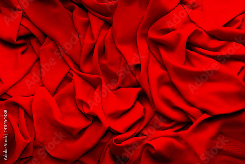 folds and texture of red fabric background