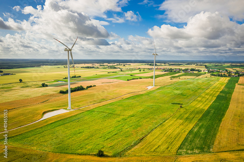 Aerial view of wind turbines on summer field, Poland