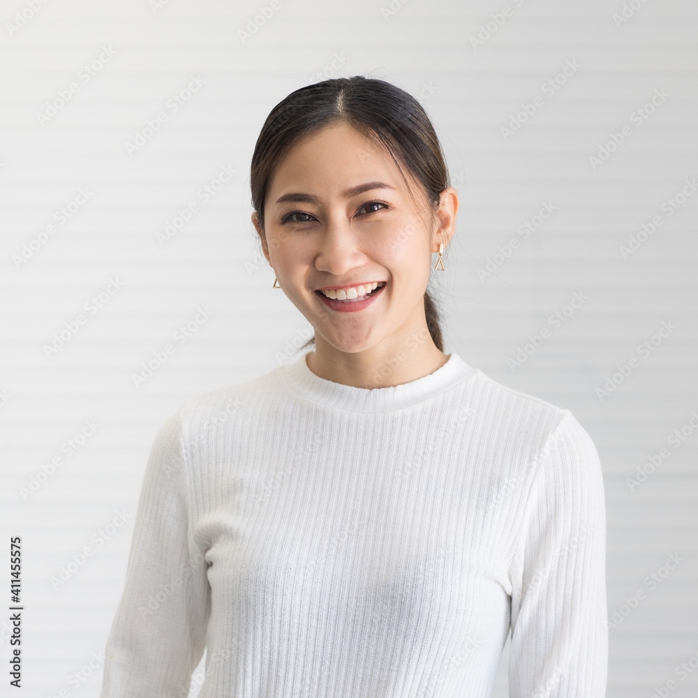 Portrait of cute beautiful Asian woman poses with a positive and friendly gesture Portrait of cute beautiful Asian woman poses with a positive and friendly gesture
