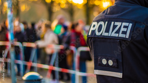 A police officer secures a demonstration in Berlin photo