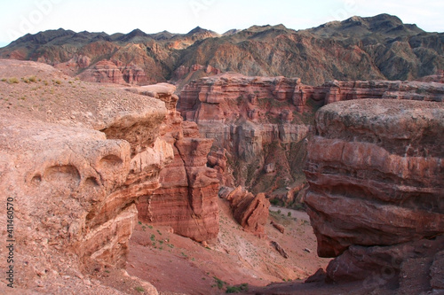 Charyn Canyon in South East Kazakhstan, summer 2019. Red rock canyon trail landscape. Trail in red rock canyon desert. Red rock canyon desert trail landscape. Yellow-red rocks of canyon in Kazakhstan.