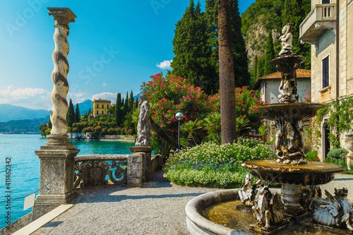 Ornamental garden of villa Monastero decorated with flowers, Varenna, Italy