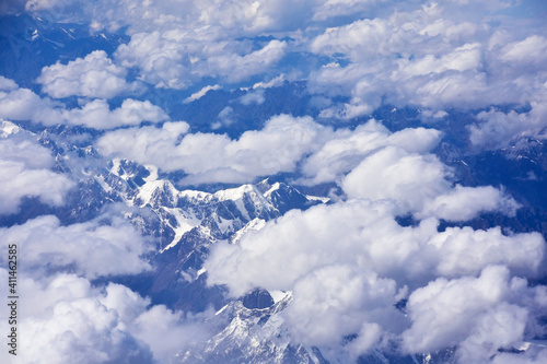 View of mountains and clouds from a bird's eye view or from an airplane.