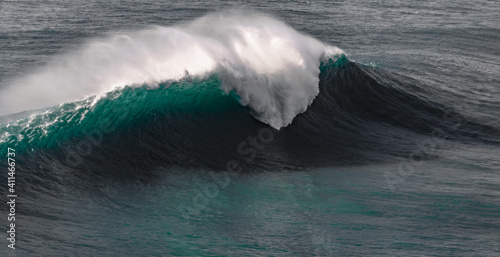 big wave breaking at Praia do Norte, Nazare