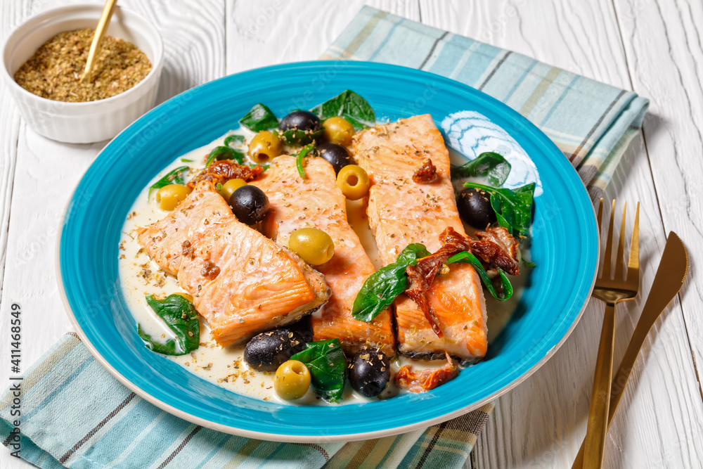 Salmon stew with cream sauce on a plate, top view Salmon stew with cream sauce on a plate, top view