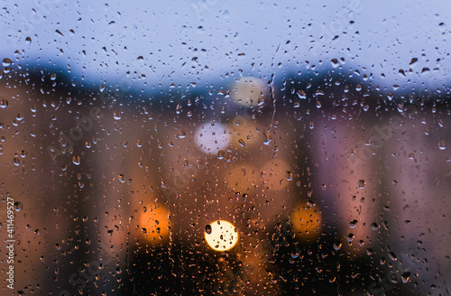 watching a rainy day in front of the window