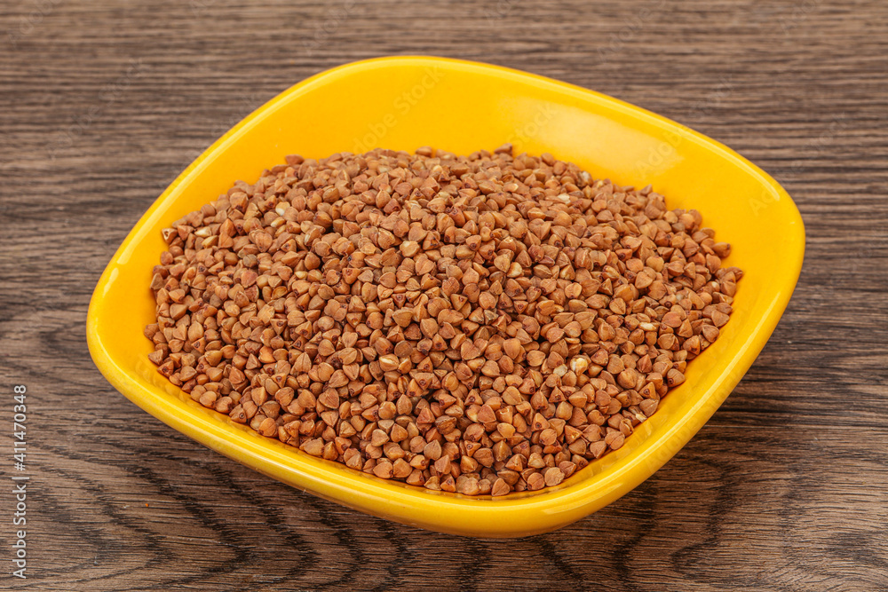 Raw buсkwheat cereal in the bowl Raw buсkwheat cereal in the bowl