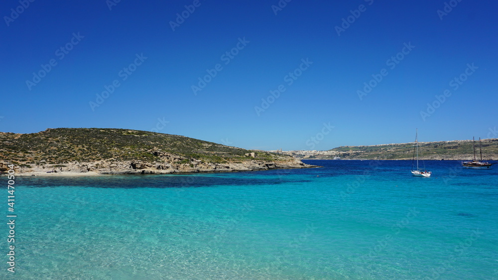 the view of Cominotto Island from the Blue Lagoon on Comino Island, Malta, March