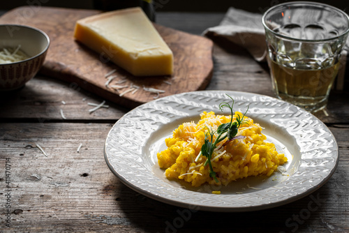 Fotografiet Rustic dinner with risotto all Milanese