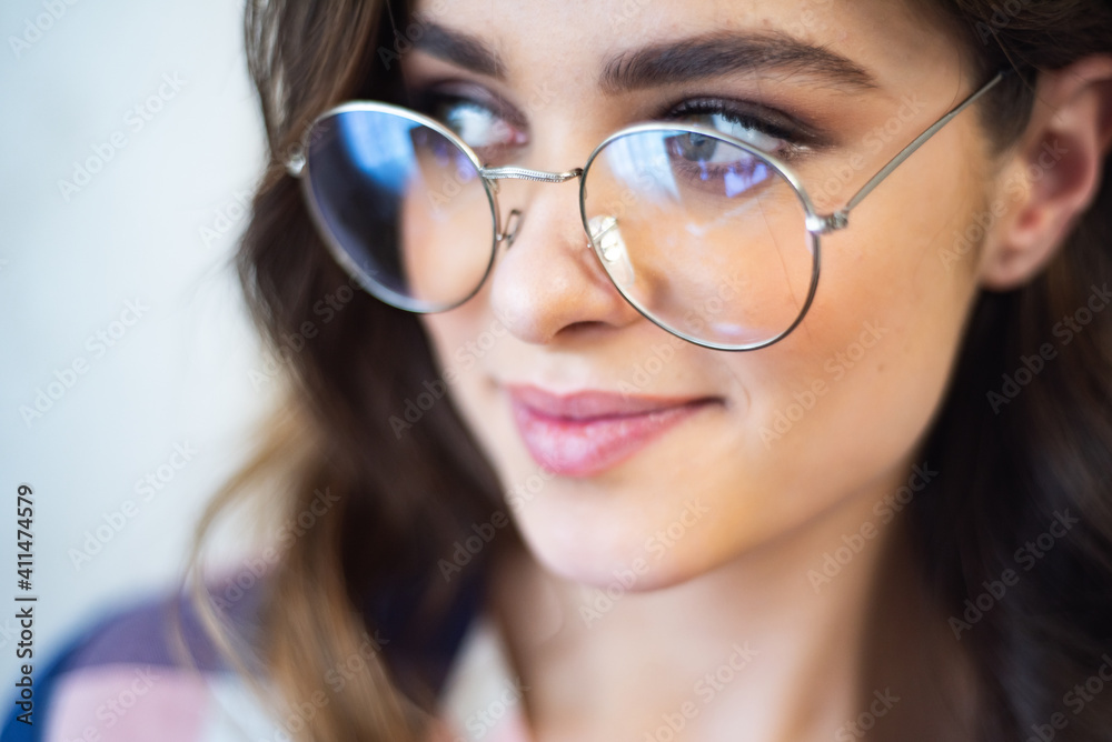 Beautiful young female student in eyeglasses Beautiful young female student in eyeglasses
