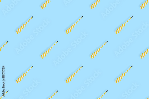 Screwdrivers seamless pattern. Metal screwdrivers with a striped rubberized handle. Background on the theme of tools  service  repair. 