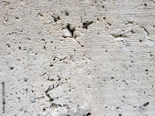 Beaten cement texture. Granular surface with depressions.