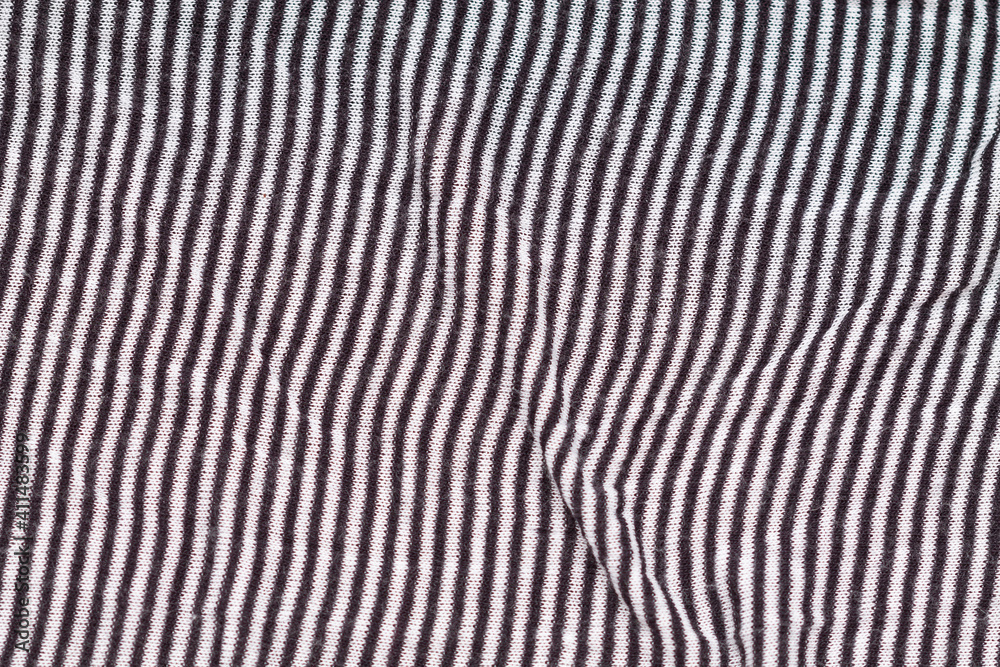 black and white thin striped waves knitted fabric with folds texture background black and white thin striped waves knitted fabric with folds texture background