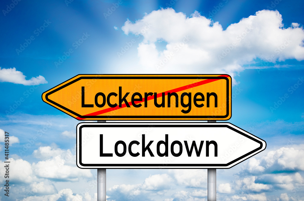 Obraz premium Road sign with german words Lockdown and Lockerungen, Lockdown and freedom with blue sky background