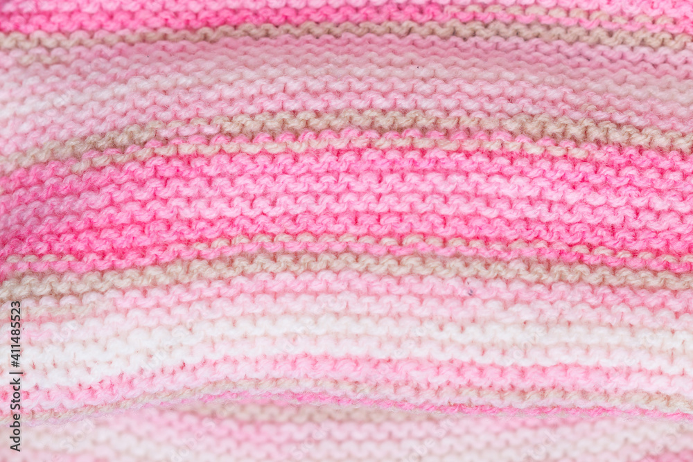 pink and white knitted snood texture background