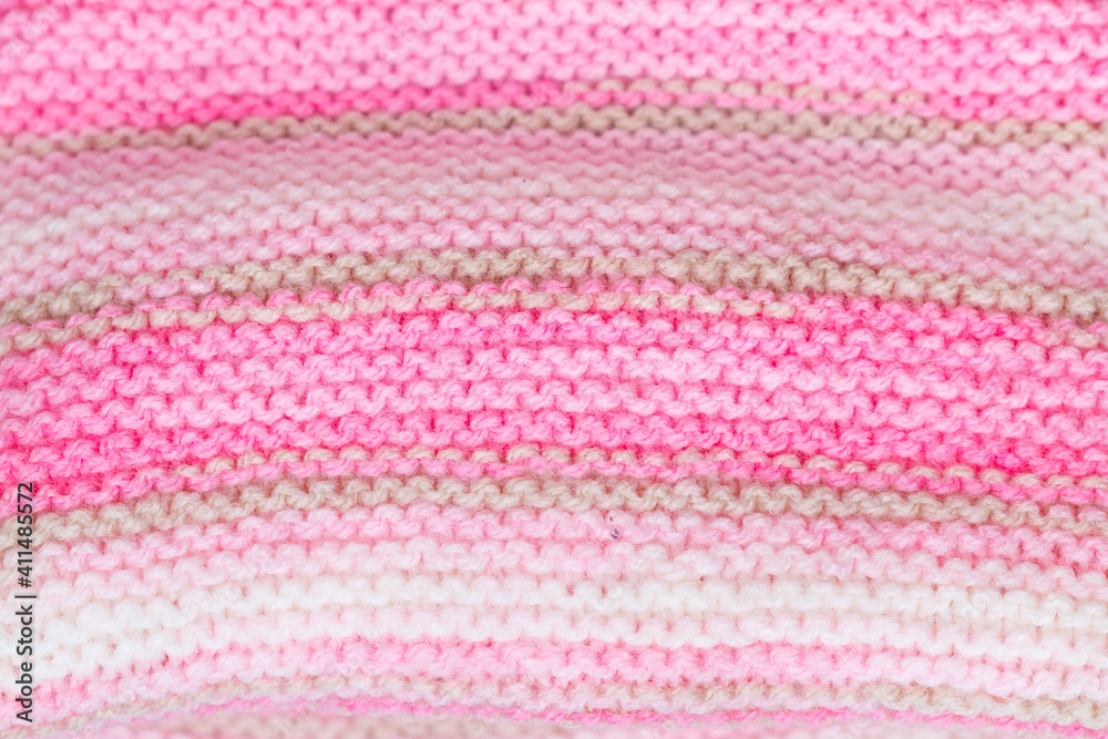 pink and white knitted snood texture background