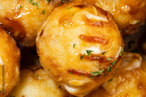 It is a round-roasted takoyaki dish with octopus in flour dough