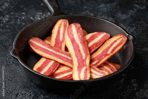 Canvas Print Fried crunchy plant based vegan Bacon pieces in a cast iron skillet