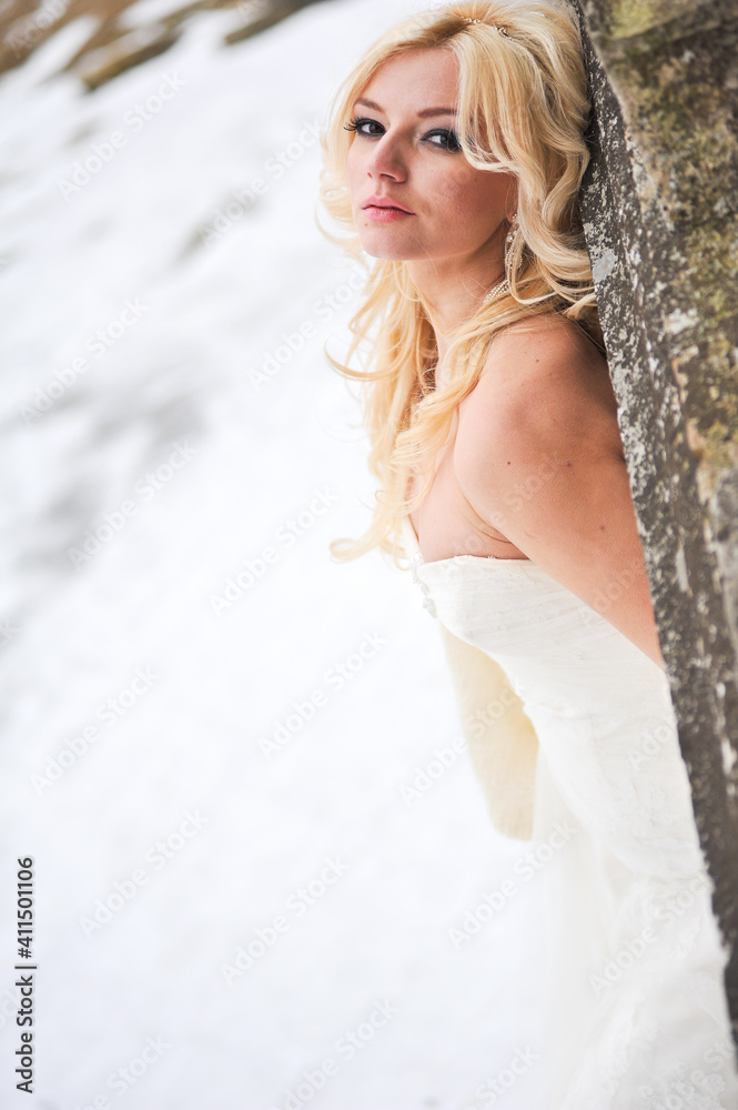 Beautiful bride near old castle on winter day wedding Beautiful bride near old castle on winter day wedding