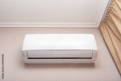 Air conditioner on the wall in the room.