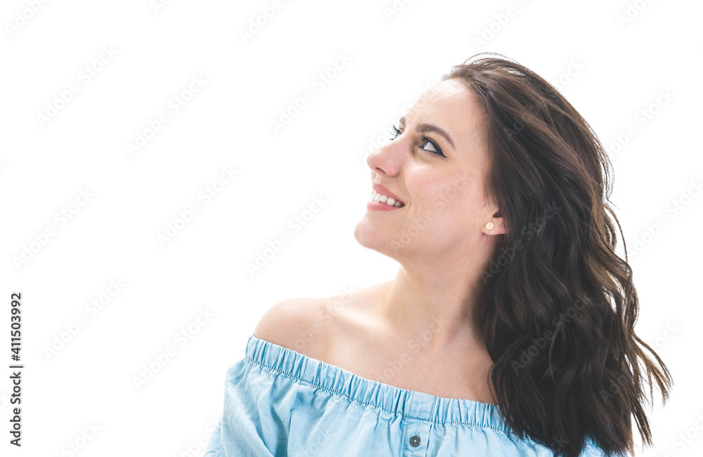Happy girl looking up, isolated on white background. Beautiful woman with crossed arms posing Happy girl looking up, isolated on white background. Beautiful woman with crossed arms posing