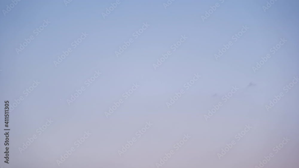 Red Clouds Vanishing into a Sky at Sunset (Time Lapse)