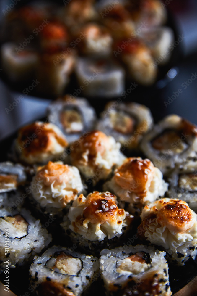 Set of Japanese sushi roll on dark background Set of Japanese sushi roll on dark background