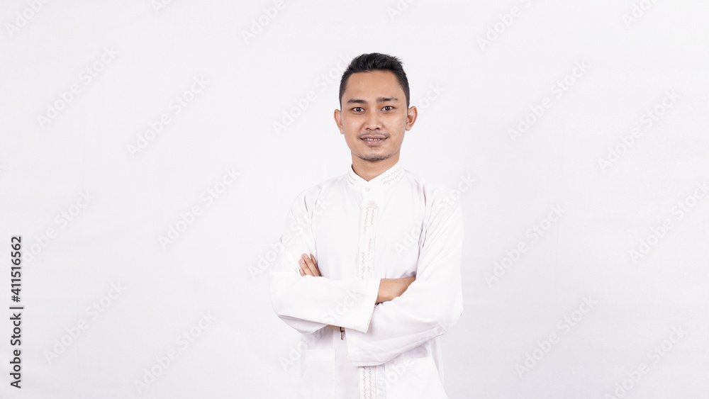 Asian man wearing moslem clothes isolated white background Asian man wearing moslem clothes isolated white background