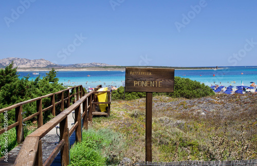 wooden bridge entrance to La pelosa beach in Stintino, Sardinia, Italy 