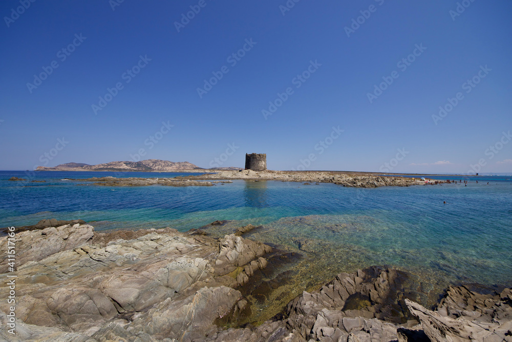 Aragonese tower in front of the La Pelosa beach in Stintino, Sardinia, Italy 