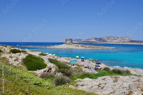 view of the ancient aragonese tower in front of la pelosa beach in Stintino, Sardinia, Italy 