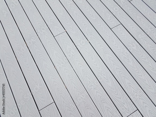 grey artificial or composite wood boards on deck with lines