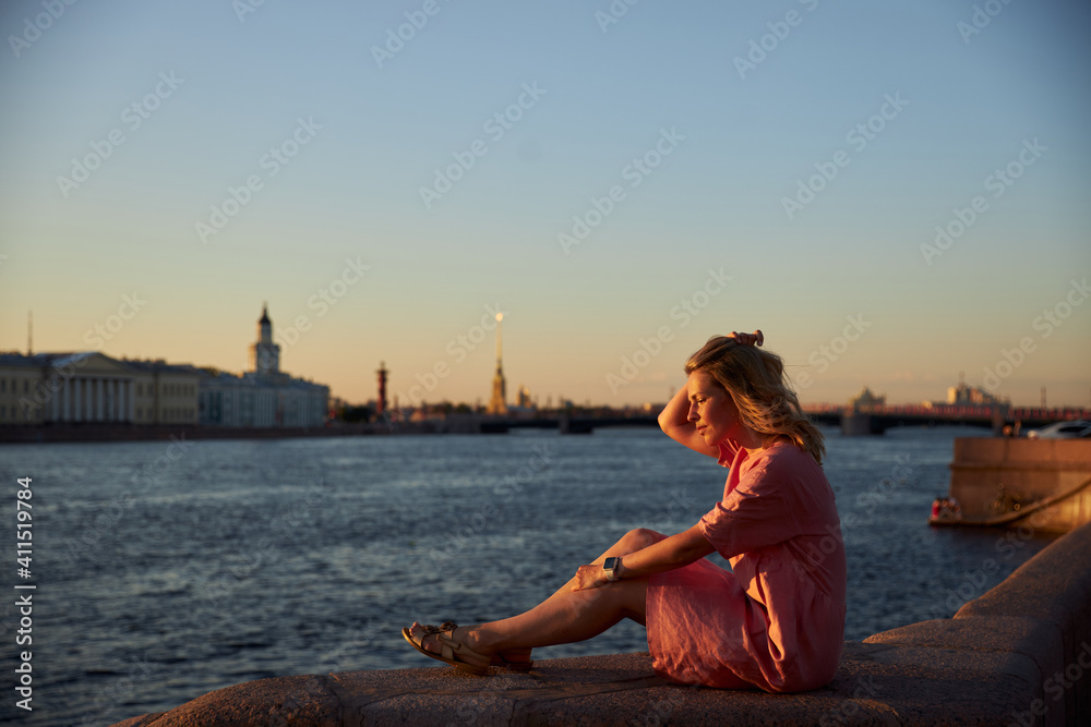woman sitting on the pier