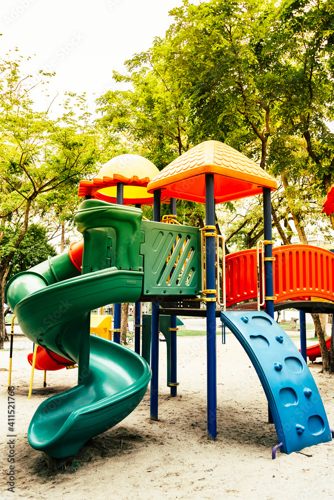 Abstract blurred playground in summer. Colorful playground equipment for kid and baby in the public park. Abstract blurred playground in summer. Colorful playground equipment for kid and baby in the public park.