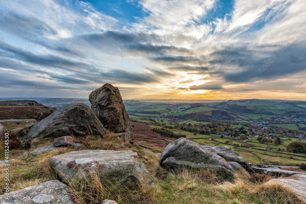 Sunset with moody clouds over Curbar Edge, Derbyshire, England