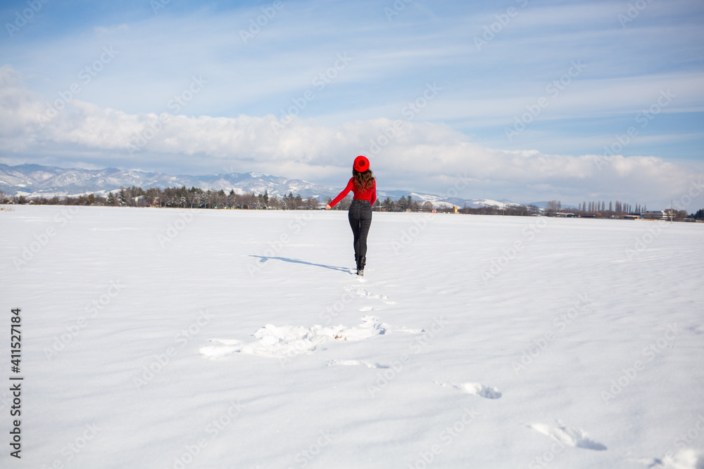 Portrait of A Woman in Snowy running in field