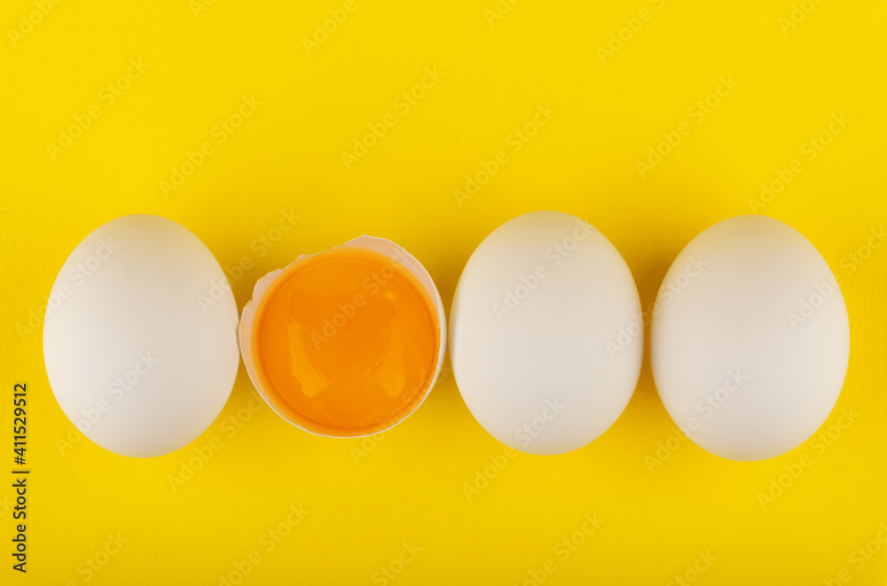 chicken eggs on yellow background top view chicken eggs on yellow background top view